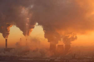 Polluting factory at dawn